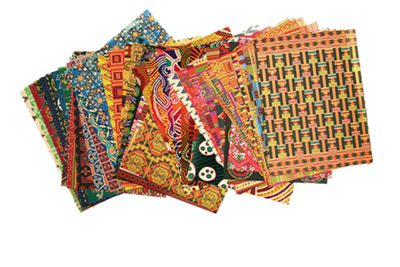 Photo of the paper sheets offered in the Around the World Paper Collection product. Each sheet of paper has a different geometric design.