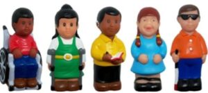 A set of Friends With Disabilities figurines. Each set includes a figure sitting in a wheelchair, a figure using forearm crutches, a figure wearing a cochlear implant, a figure with Down syndrome, and a figure wearing dark sunglasses and holding a white cane to aid visual impairment.