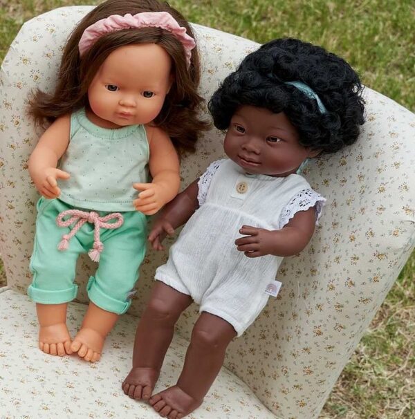 cuacasian and african american ethnic dolls standing