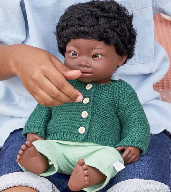 dressed african american male ethnic doll with down syndrome