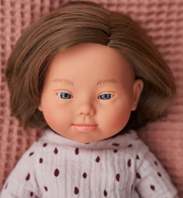 caucasian girl ethnic doll with down syndrome close up