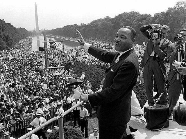 Photo of Martin Luther King Jr. giving a speech before the Washington Monument as part of the March on Washington for Jobs and Freedom.