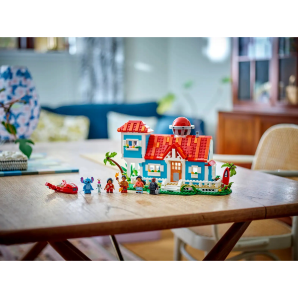 The LEGO Disney's Lilo and Stitch Beach House playset sits on a table.