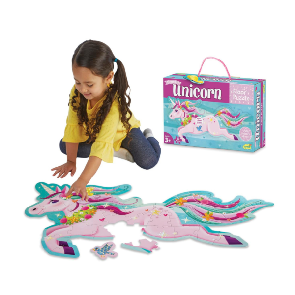 Young Girl playing with Peaceable Kingdom's Shimmery Unicorn Floor Puzzle